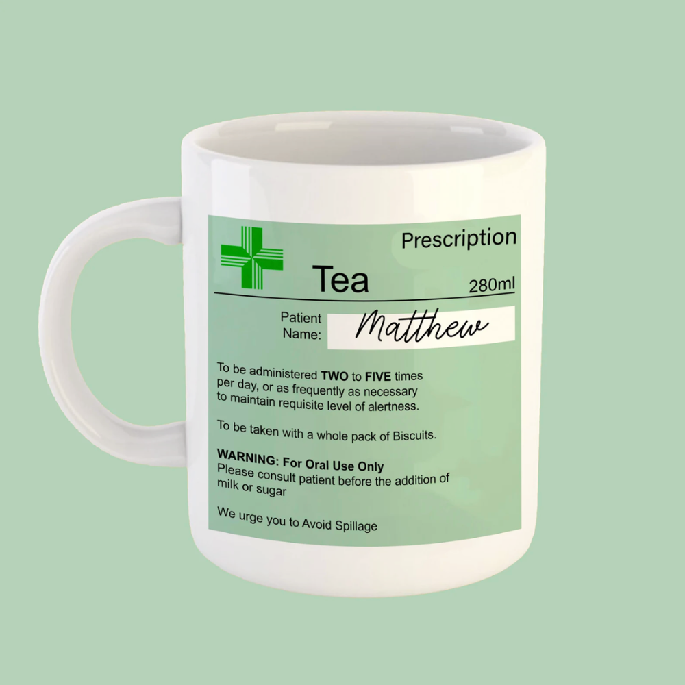 White mug with a green prescription label on a light green background
