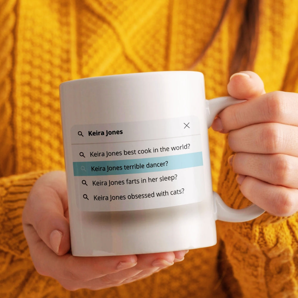 Person holding a mug with text about Keira Jones