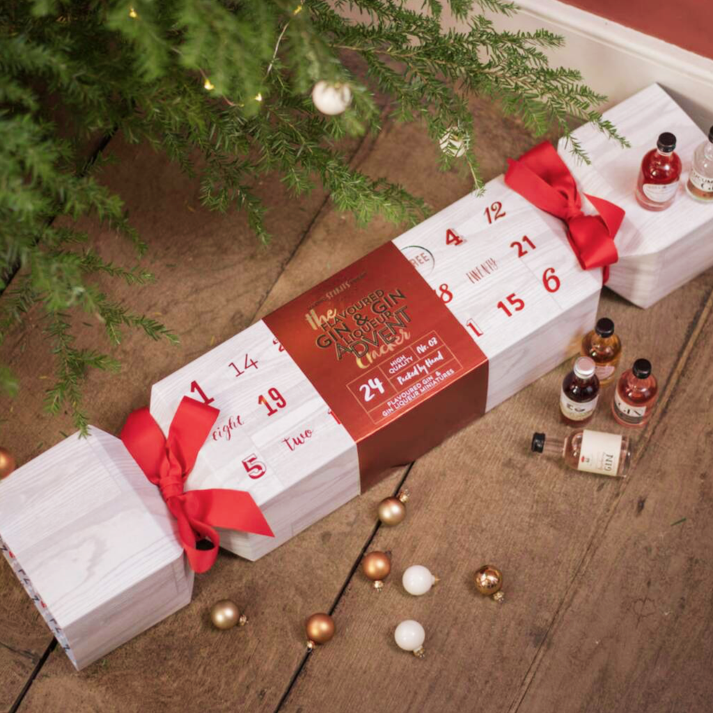 Giant Gin Filled Advent Cracker with 24 miniature gins displayed beneath festive Christmas decorations