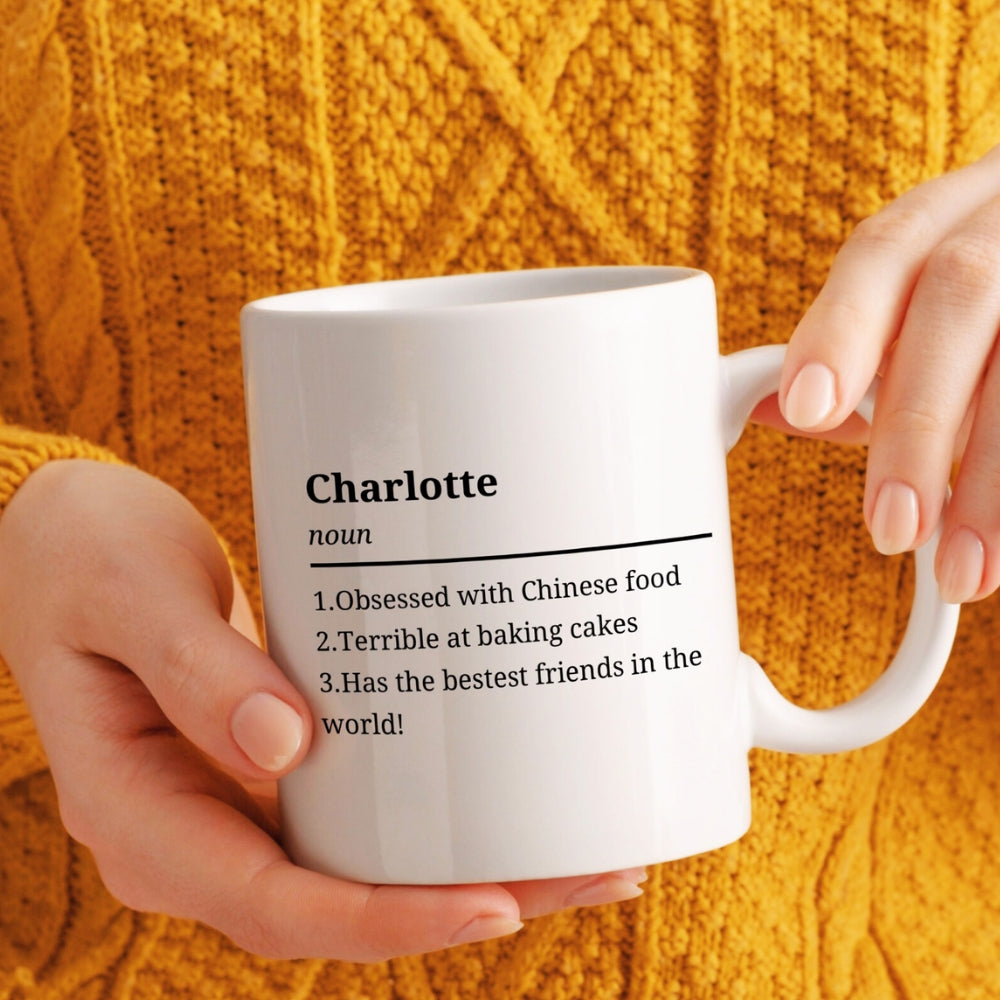 Person holding a white mug with text against an orange textured background