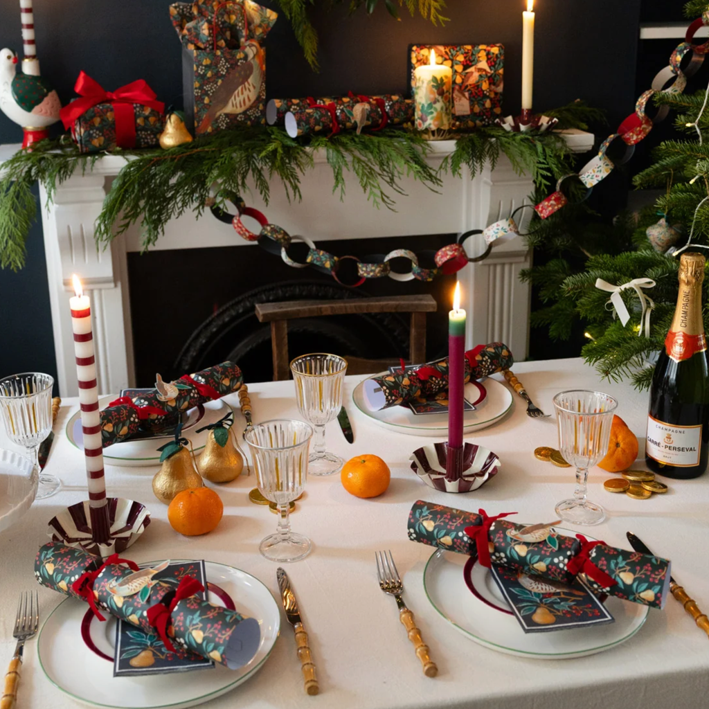 Forest green woodland Christmas crackers styled on a festive dinner table