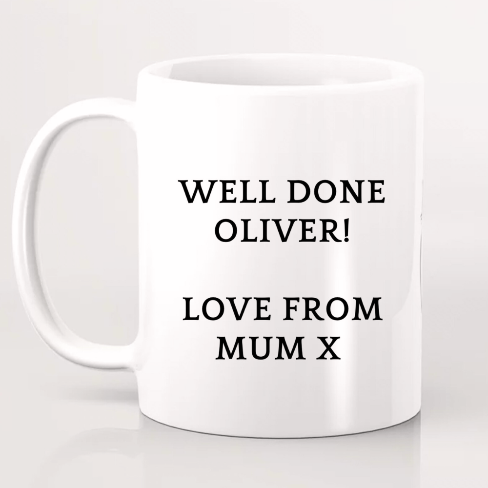 White mug with black text 'WELL DONE OLIVER! LOVE FROM MUM X' on a light gray background