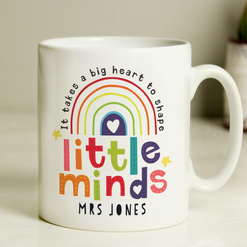 Personalised Little Minds teacher mug product shot on white surface showing Mrs Jones name with rainbow and stars design