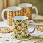 Three patterned mugs on a wooden surface with a blurred background