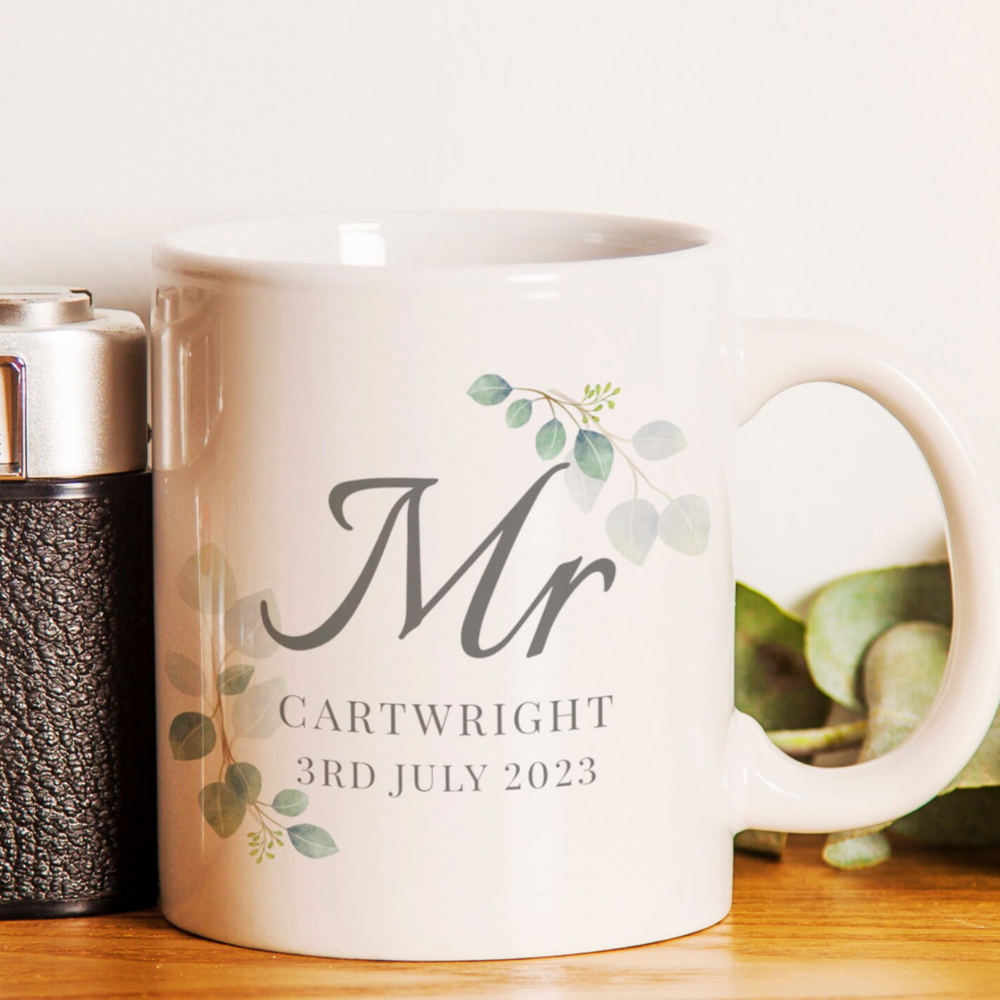 White mug with 'Mr' and personalized text on a wooden surface