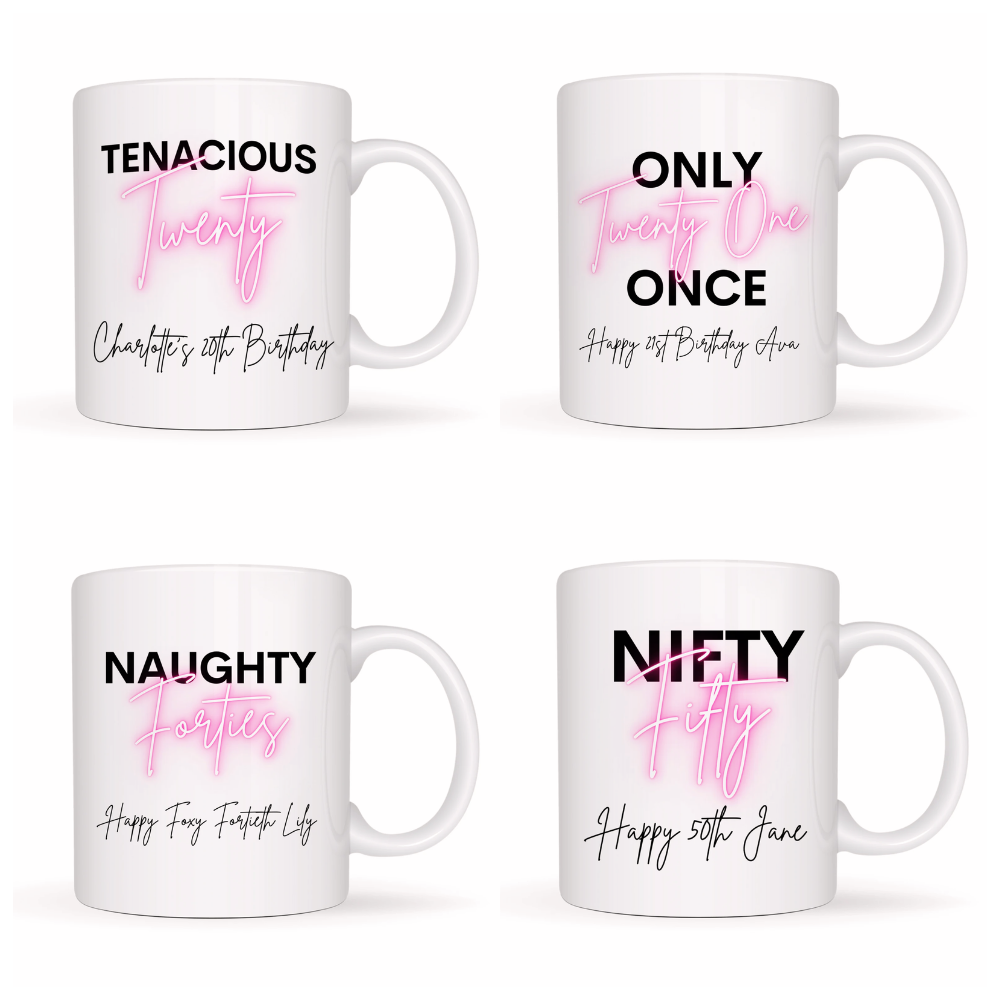 Four white mugs with pink and black text on a white background
