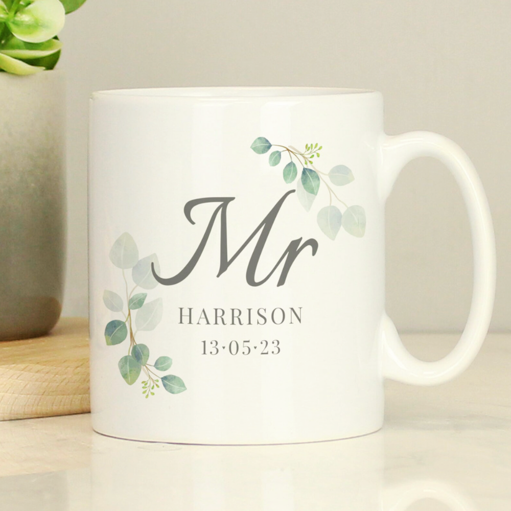 White mug with 'Mr' and personalized name and date on a light background
