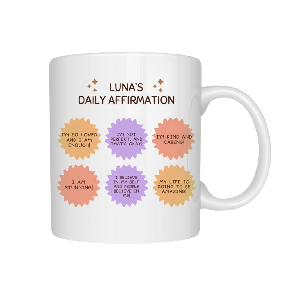White mug with colorful daily affirmation text on a white background