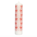 A white advent candle with red vertical stripes, red bows, and numbered days from 1 to 24 printed vertically, shown on a plain white background.
