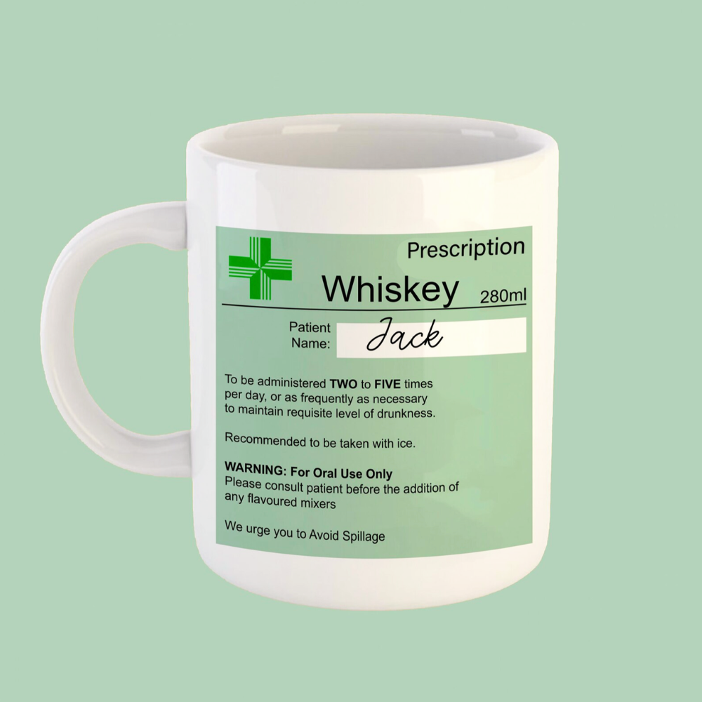 Mug with a humorous prescription label for whiskey on a light green background