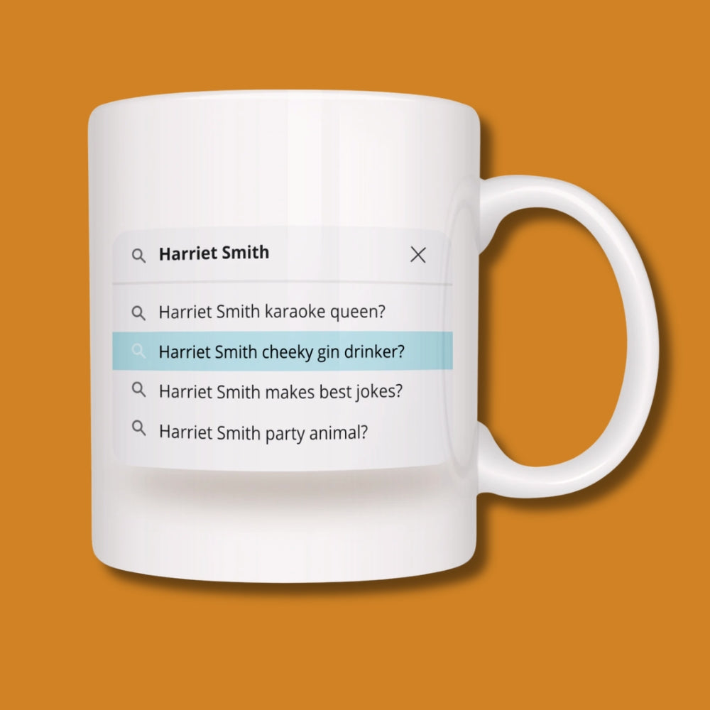 White mug with a humorous search bar graphic on an orange background