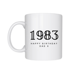 White mug with '1983 Happy Birthday Dad X' text on a white background