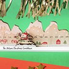 Detail of the wooden Santa Christmas countdown calendar with numbered days