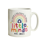 Personalised Little Minds teacher mug held in two hands showing Miss Jackson name on front with rainbow design
