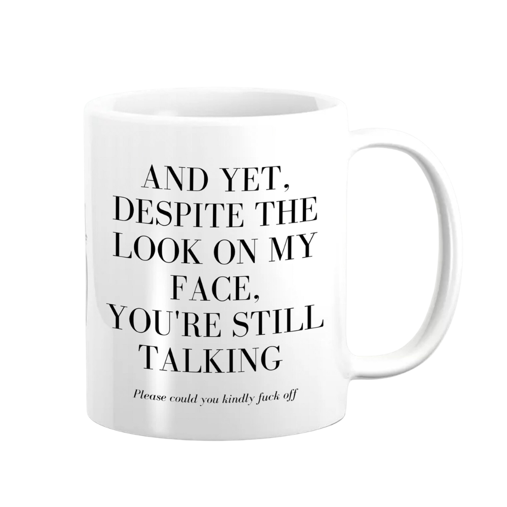 White mug with black text on a white background
