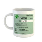White mug with a green label resembling a prescription, featuring the word 'Dad'.