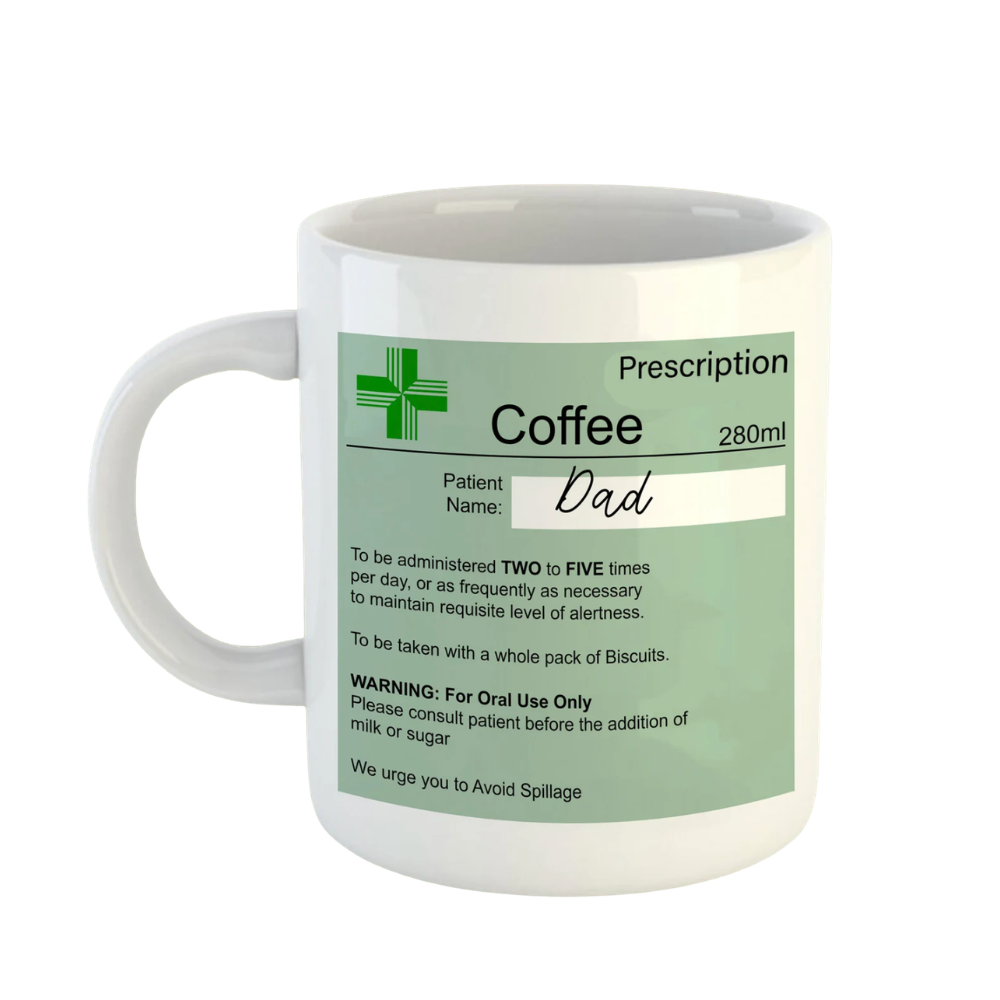 White mug with a green label resembling a prescription, featuring the word 'Dad'.
