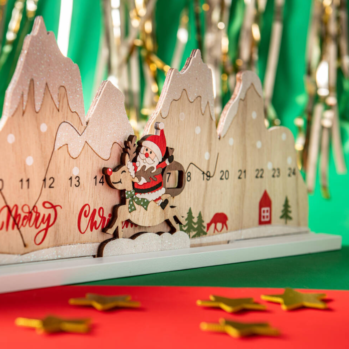 Personalised Santa and reindeer wooden Christmas countdown displayed with festive decorations