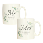 Two white mugs with 'Mr' and 'Mrs' text and decorative elements on a white background