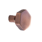 A hexagonal cabinet knob with a warm copper or bronze finish, shown from an angled perspective against a plain white background.