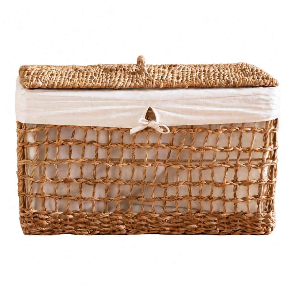 A rectangular woven storage basket with a lid, made from natural tan seagrass or wicker, lined with a cream fabric liner and tied with a small bow at the front.