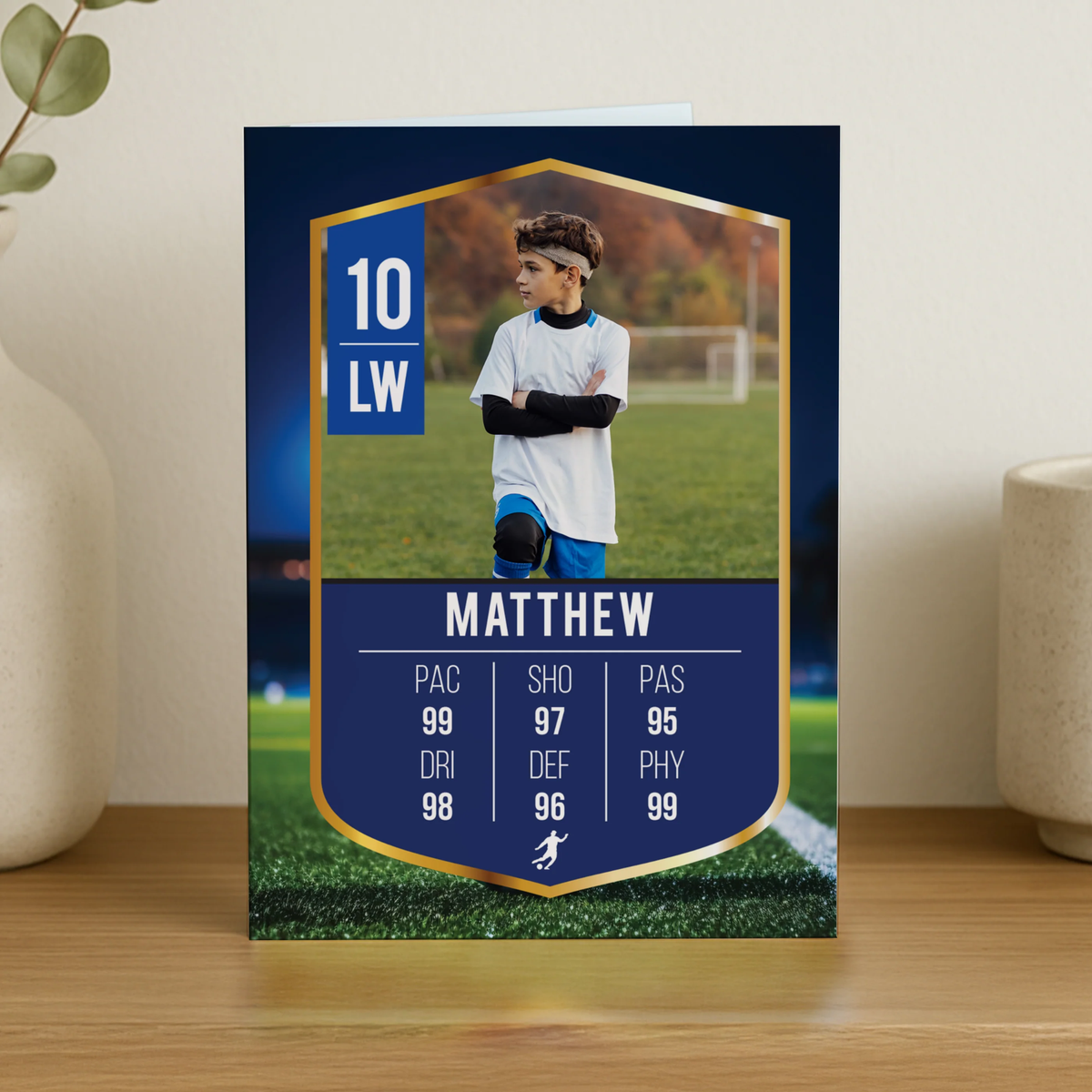 Soccer player card with stats on a wooden surface
