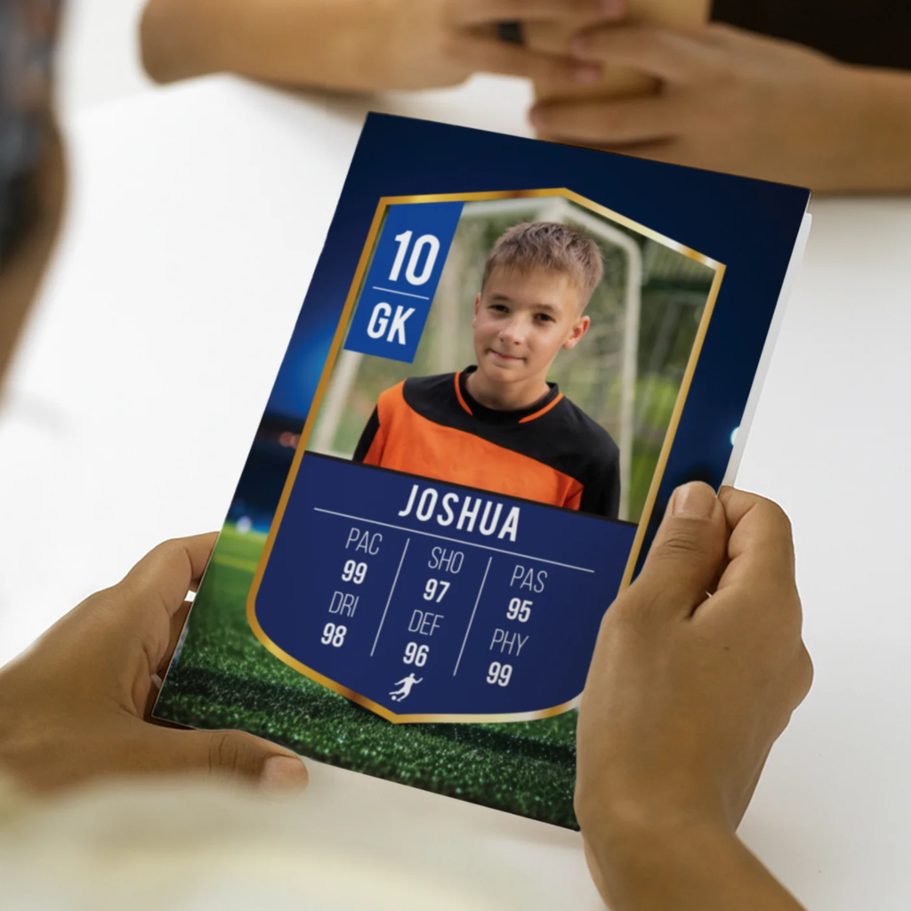 Soccer trading card with a player named Joshua held by hands on a blurred background