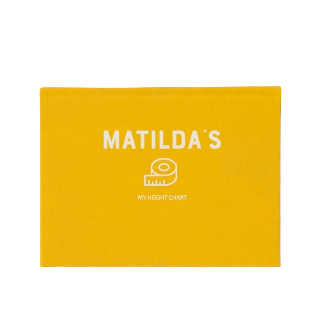 A bright yellow rectangular fabric height chart card featuring the white printed text 'MATILDA'S' and 'MY HEIGHT CHART' with a small tape measure icon.