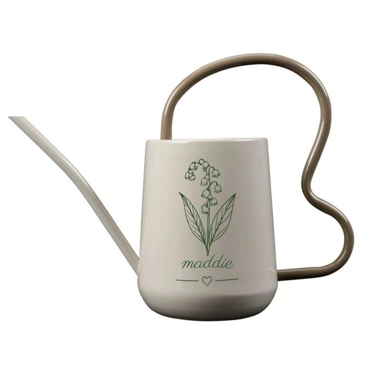 A ceramic watering can with a long, thin spout, a wavy handle, and a printed green lily of nectarus flower design on the front. The name 'maddie' is written in cursive below the illustration.