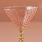 A Pair Of Pink And Green Coupe Cocktail Glasses