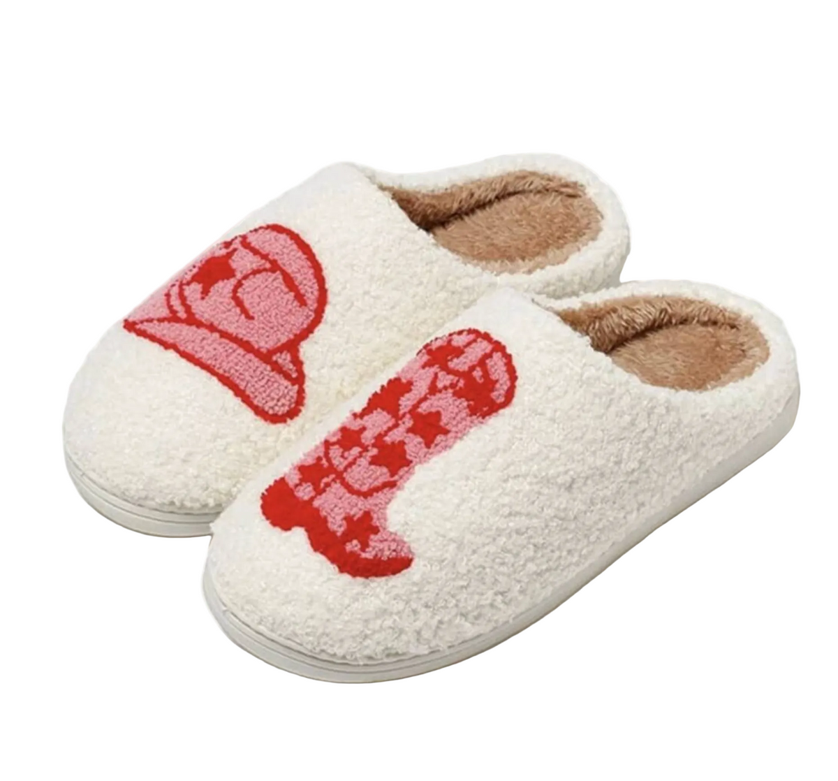 A pair of fluffy white sherpa slip-on slippers with red embroidered cartoon-style graphics on the top, shown on a clean white background.