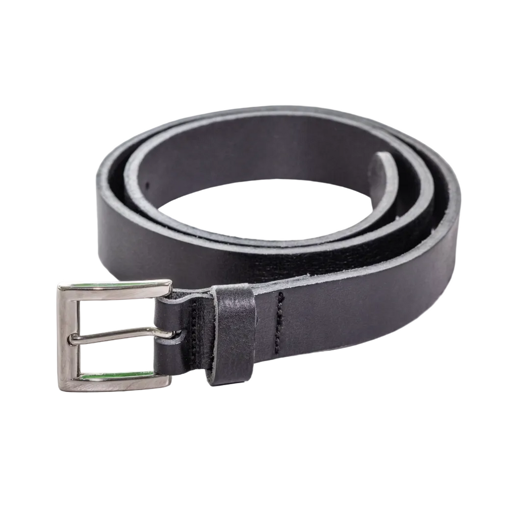 Black leather belt with silver buckle on a light wooden surface