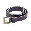 Black leather belt with silver buckle on a light wooden surface