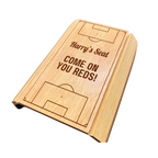 Wooden product with 'Harry's Seat' and 'Come on You Reds!' text on a white background