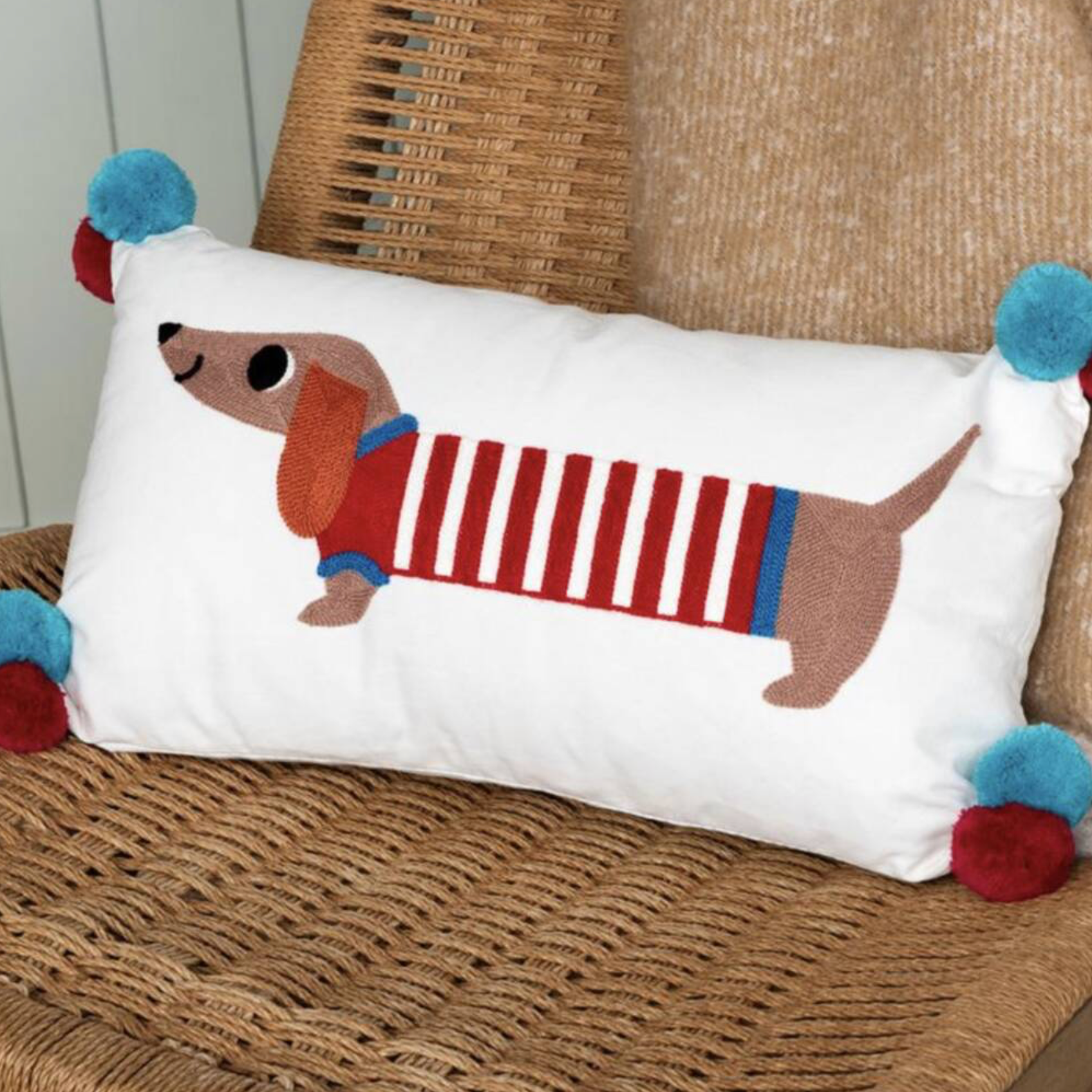 Embroidered Sausage Dog Cushion with Pom Poms