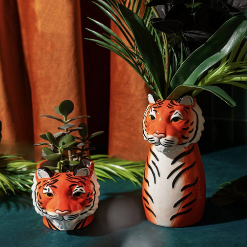 Ceramic Tiger Vase with large tropical plant growing from the top, jungle backdrop