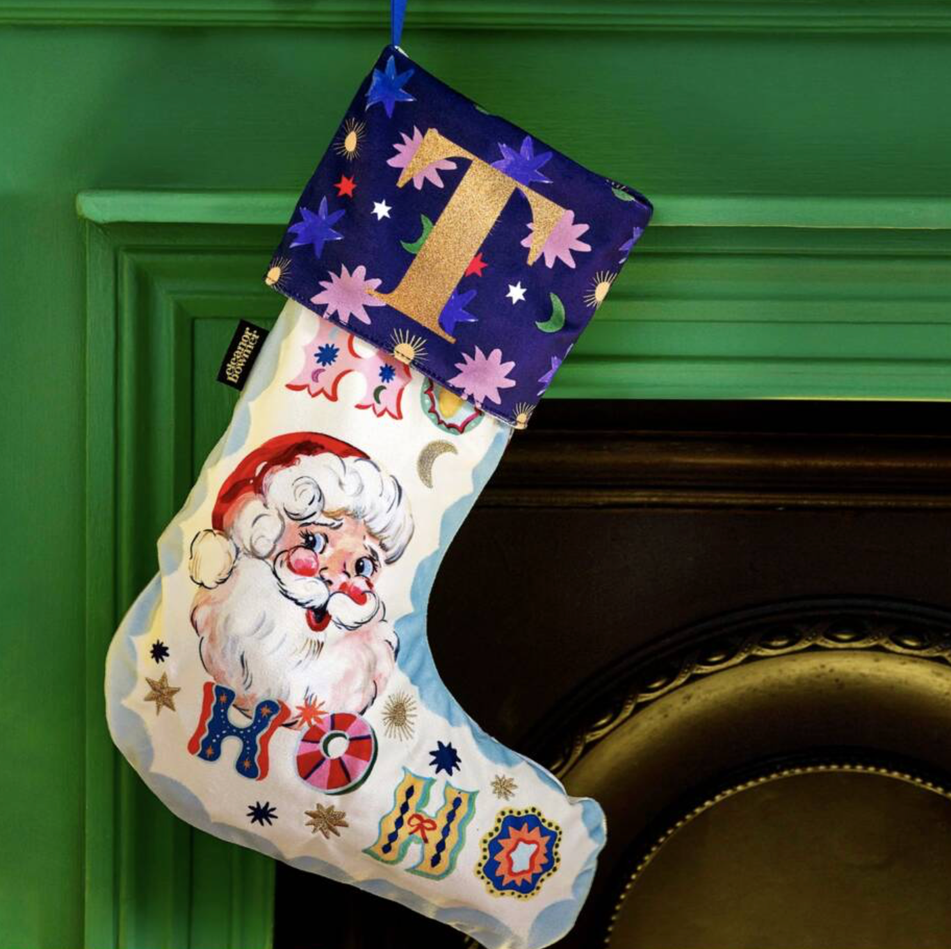 Embroidered Santa Velvet Stocking on white background showing the full stocking shape and navy cuff