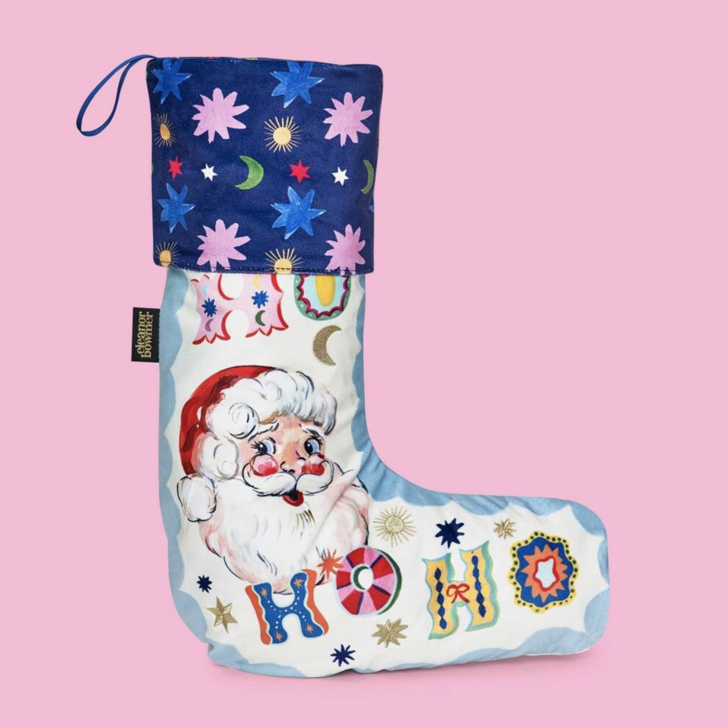Close up of the gold embroidered star and Ho Ho Ho detail on the velvet stocking body