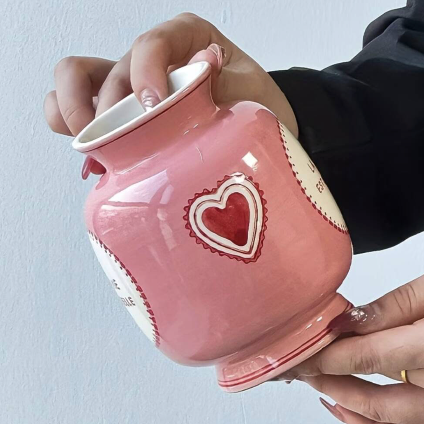 Close up of the Mini Pink Dopamine Vase showing the embossed red heart motif detail