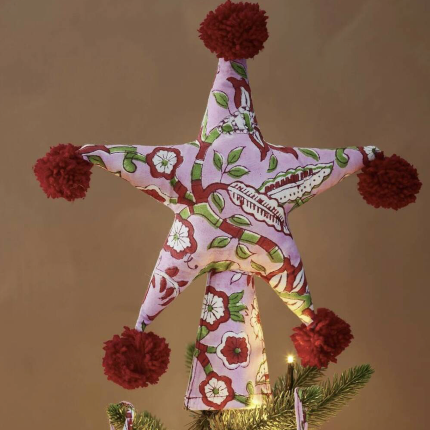Product listing screenshot for Two Sided Pom Pom Padded Fabric Star Tree Topper showing price and product details