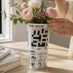 Daily Crossword Ceramic Vase on white background showing the Good News column and crossword print wrapping around the conical form