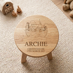 Personalised Noah's Ark Wooden Stool with name Freddie and christening date laser engraved on white background showing the full Noah's Ark scene