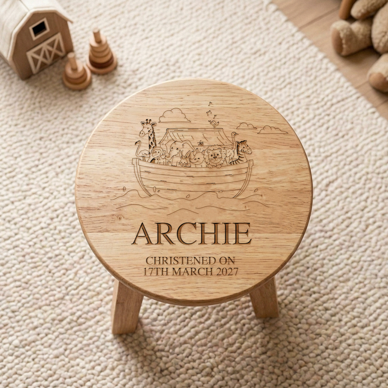 Personalised Noah's Ark Wooden Stool with name Freddie and christening date laser engraved on white background showing the full Noah's Ark scene