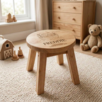 Personalised Noah's Ark Wooden Stool with name Leo and christening day message styled in a nursery with wooden toys and a cream dresser