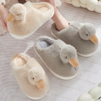 Cream duckling slippers being worn for a cosy day at home