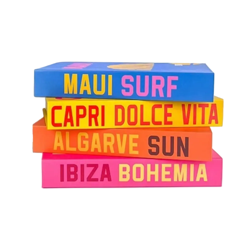 A set of colorful French Riviera travel book spines and matching stackable book covers on a white background. Visible titles include Mykonos Muse, Palm Beach, St.
