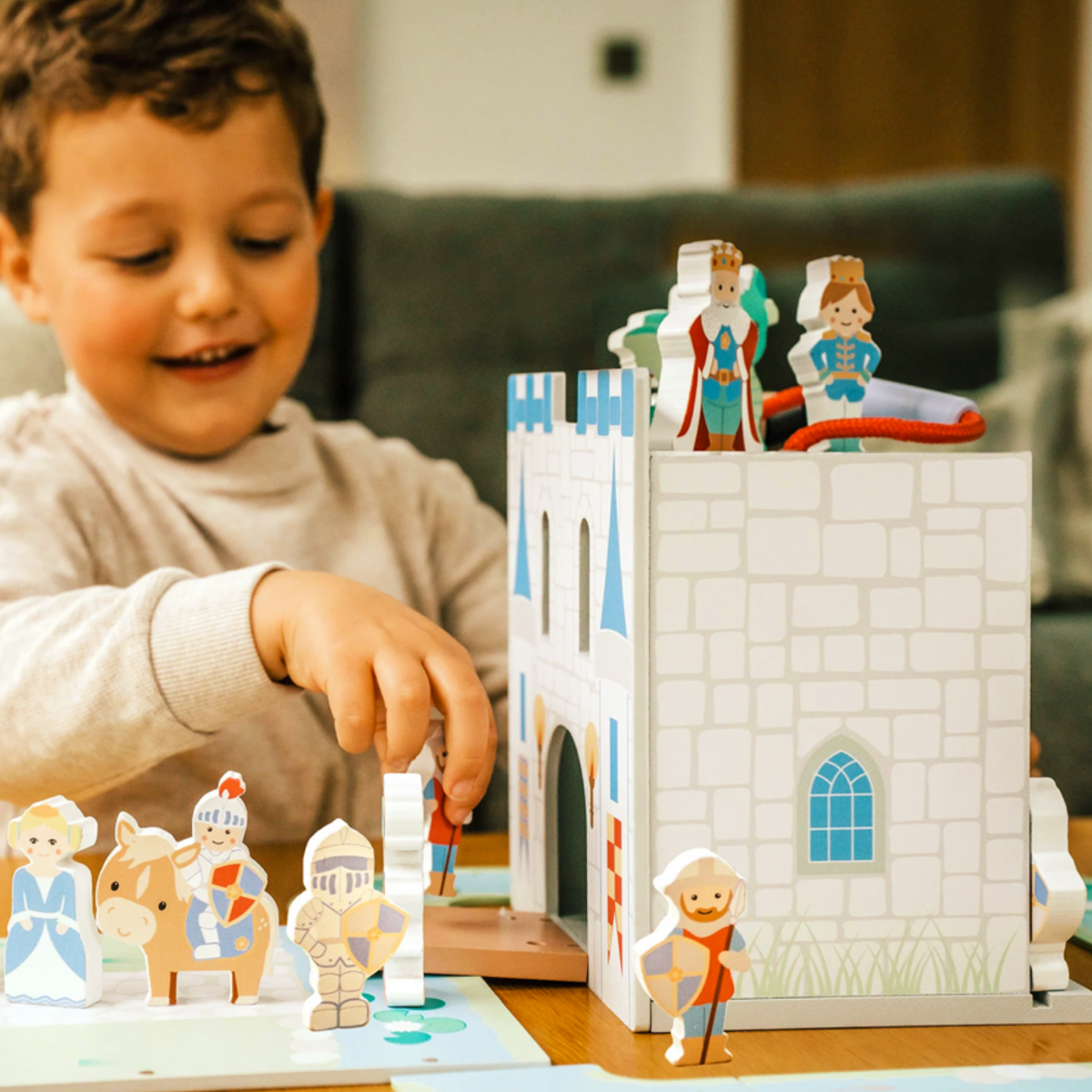 Open wooden castle play set with knight and royal character inside
