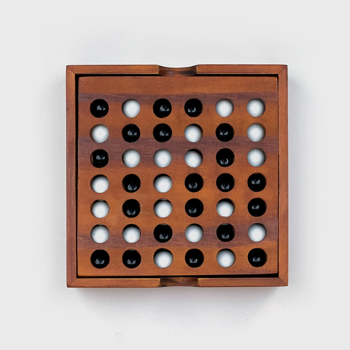 Personalised wooden Travel Four In A Row game engraved Mark vs Ellie with black marbles