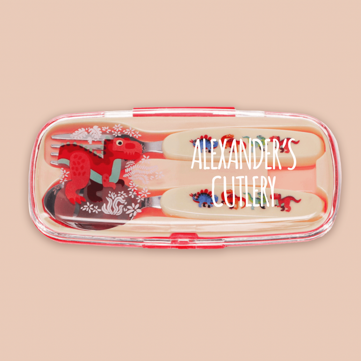 A children's cutlery set in a clear plastic case with red trim, featuring dinosaur-themed handles and utensils, shown on a solid beige background. The text 'ALEXANDER'S CUTLERY' is overlaid on the image.