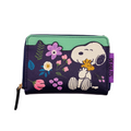A Peanuts-themed zip-around wallet featuring Snoopy and Woodstock on a dark purple background with colorful floral illustrations, a mint green top panel, and a purple 'PEANUTS' brand tab on the side.